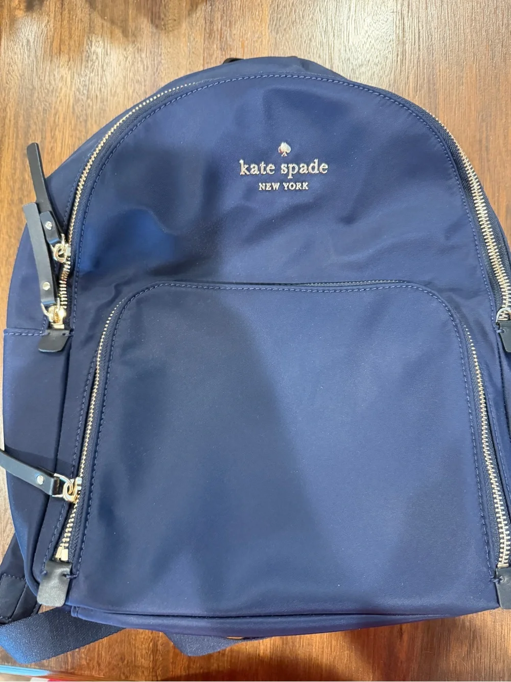 kate spade navy blue nylon backpack with gold hardware
